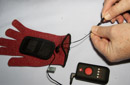 Attach Heating Pad to Palm of Red Glove, Attach Black Lead wire to glove