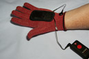 Put on red glove with black heat patch in palm